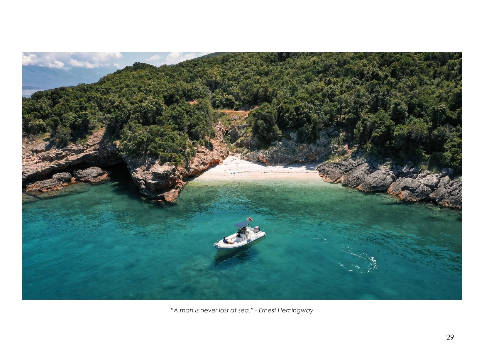 A boat in the clear water of Dafina Bay, photographed by Altin Serani
